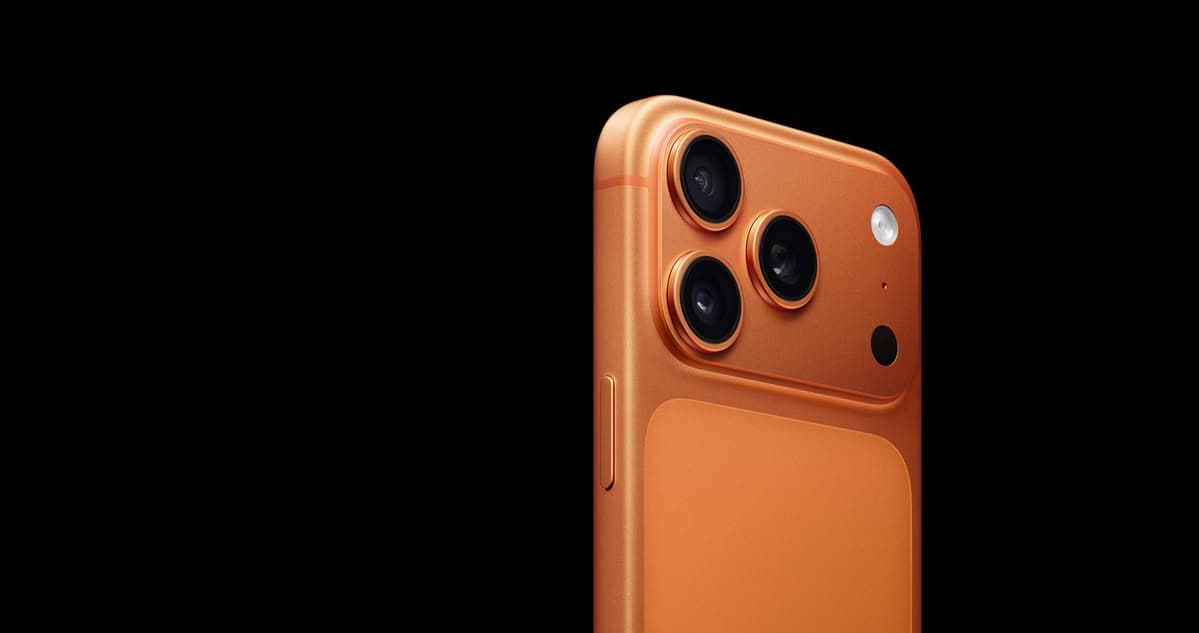 Close view of an orange Pro iPhone against black